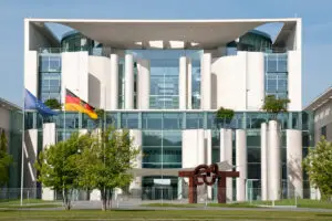 Exterior view of the Federal Chancellery in Berlin, showing the modern government building from the front.