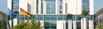 Exterior view of the Federal Chancellery in Berlin, showing the modern government building from the front.