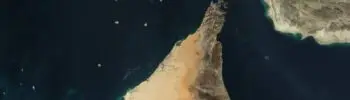 Satellite image of the Strait of Hormuz, showing the narrow maritime passage between Iran and Oman.