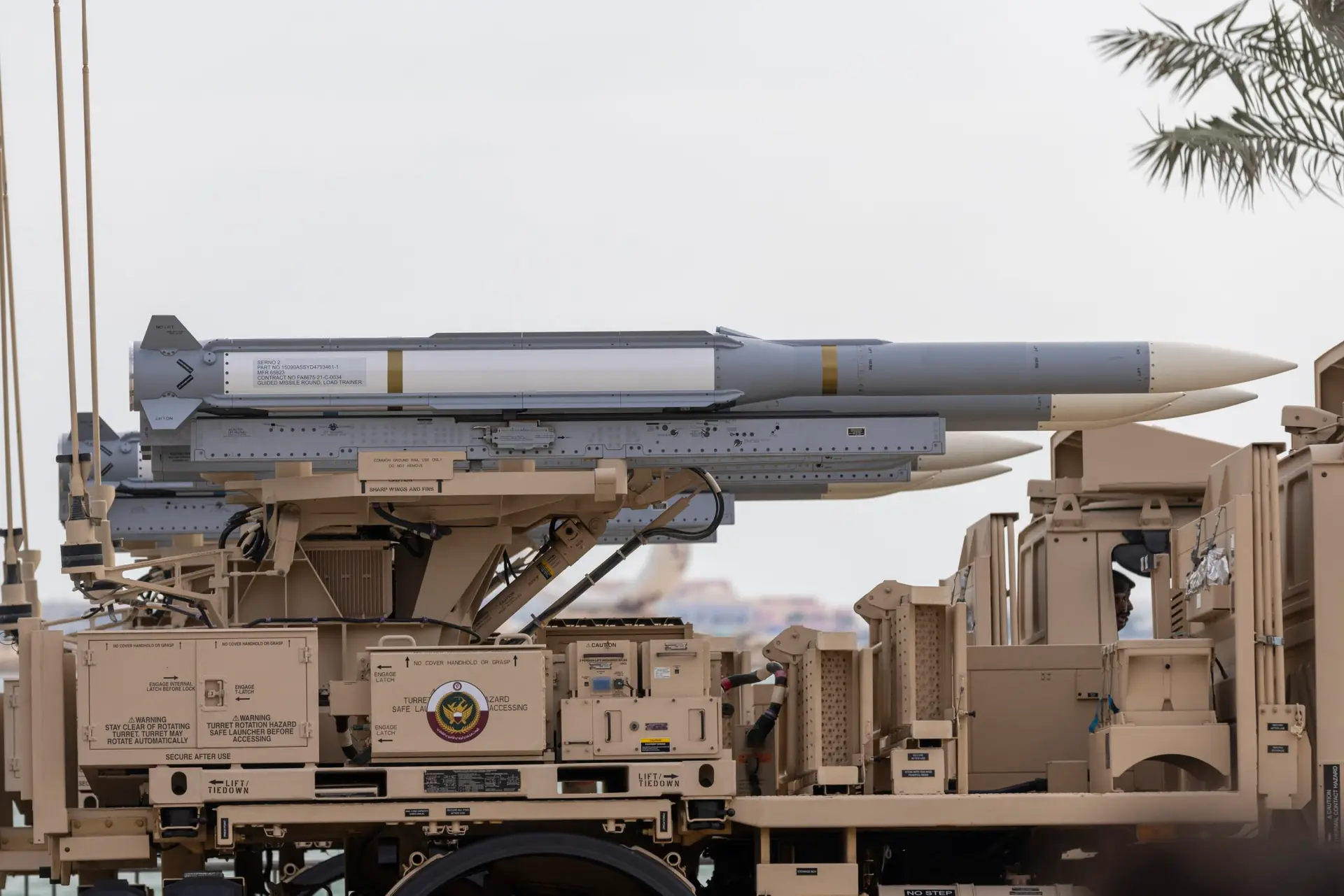 Patriot surface-to-air missile launcher in the desert near Doha, Qatar, illustrating modern US air-defense deployed in the Gulf region.