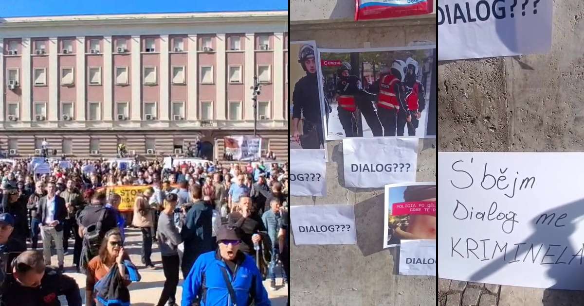Thousands of protesters outside the Prime Minister’s office in Tirana on October 20, 2026; on the wall, signs reading ‘DIALOG???’ and ‘We don’t hold dialogue with criminals’.